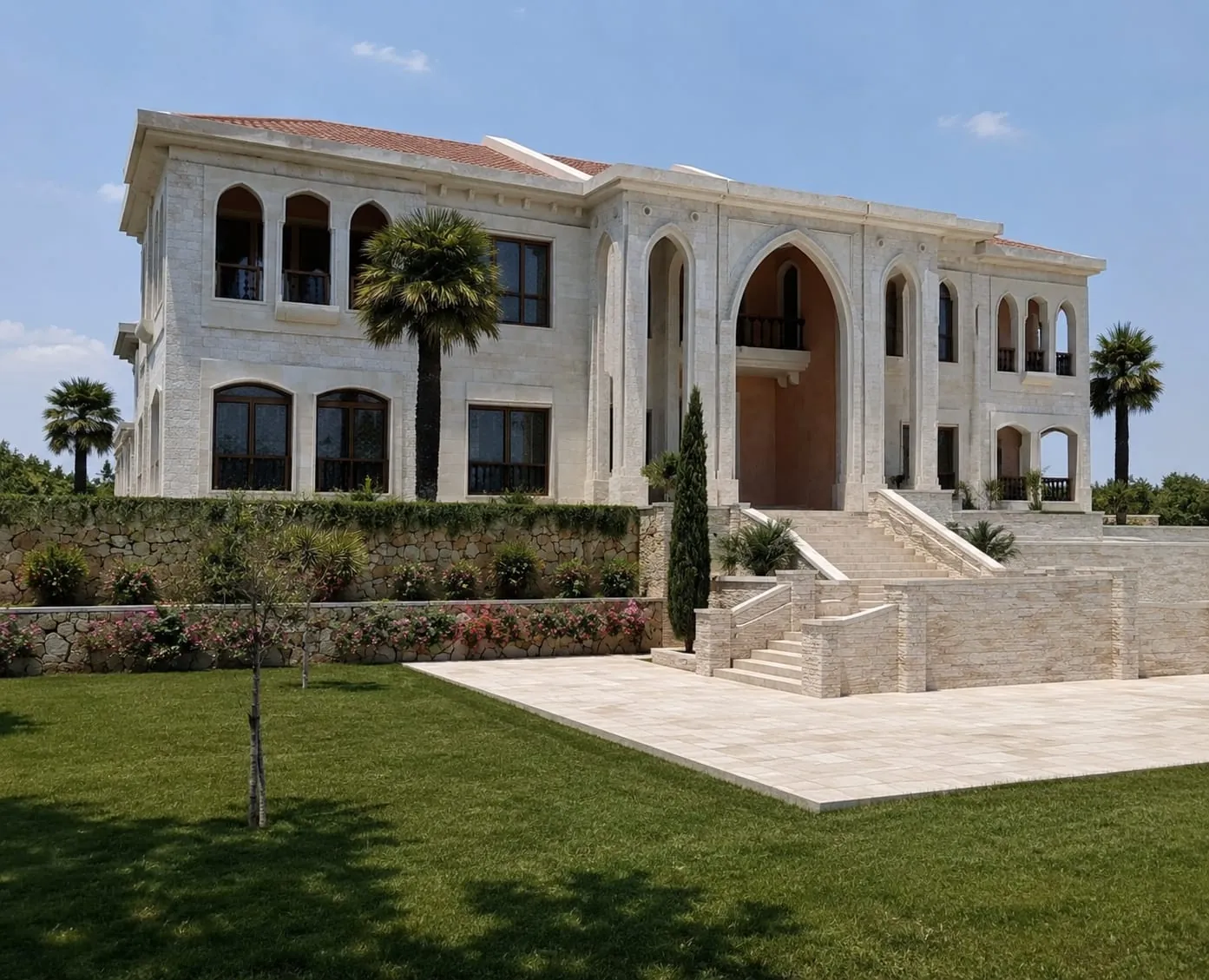 Stone villa in South Lebanon with arched facade and lawn